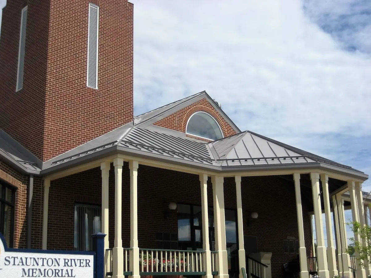 Skilled roofing craftsmen working on a residential roof in Bay Towne